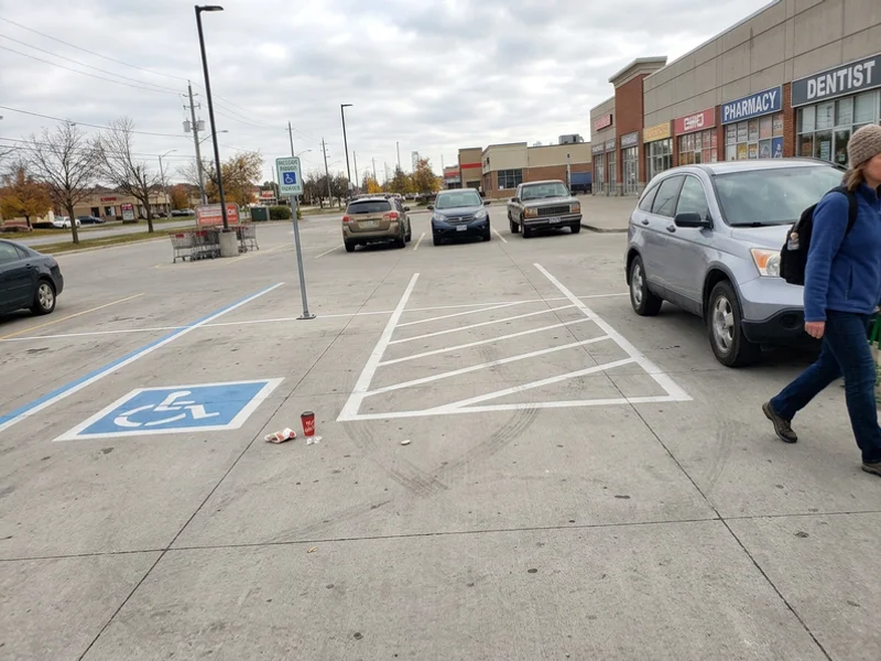 Finished concrete parking lot with saw-cut joints and painted stalls