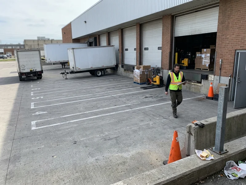 Heavy-duty concrete approach apron in front of multiple loading bays