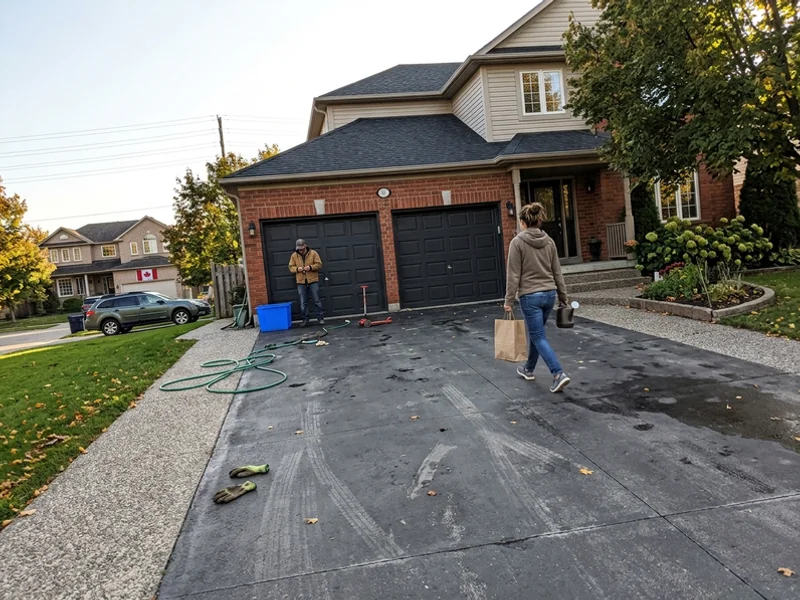 Wide driveway with a decorative border and coloured apron