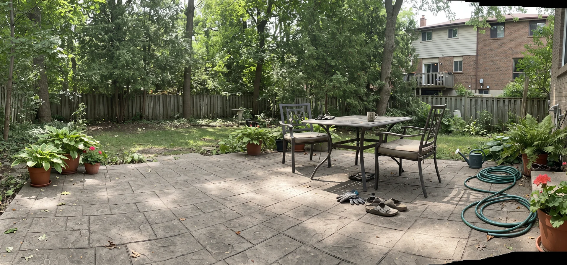 Stamped concrete patio in an ashlar slate pattern in a Toronto backyard